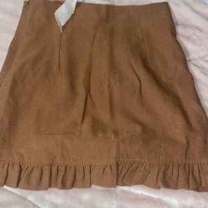 Camel colored mini skirt. Size medium. Brand new never worn.